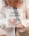 Little girl trying to do up buttons on school shirt